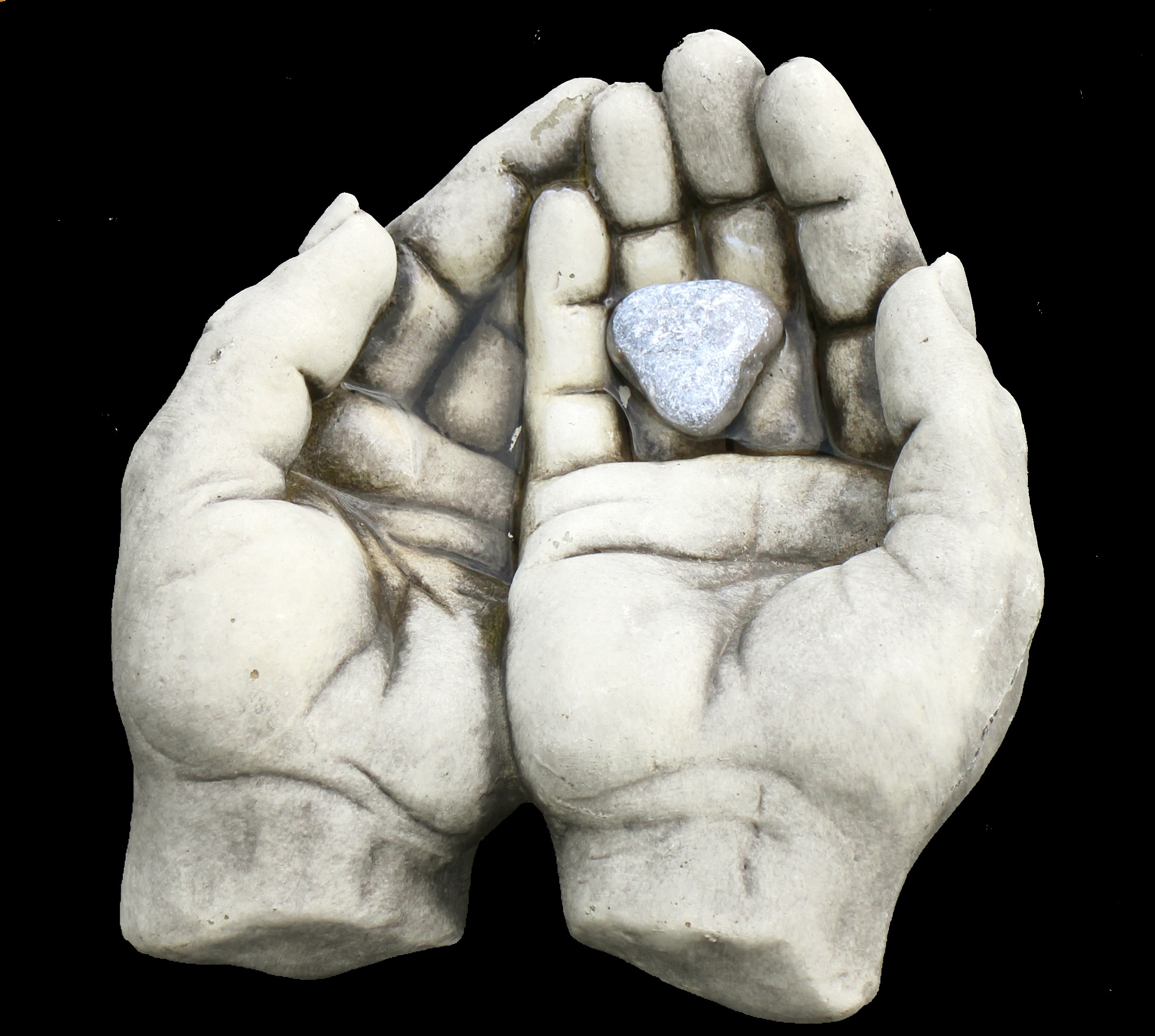 Sculpted stone hands cradling a heart-shaped stone in water, symbol of community support and exchange